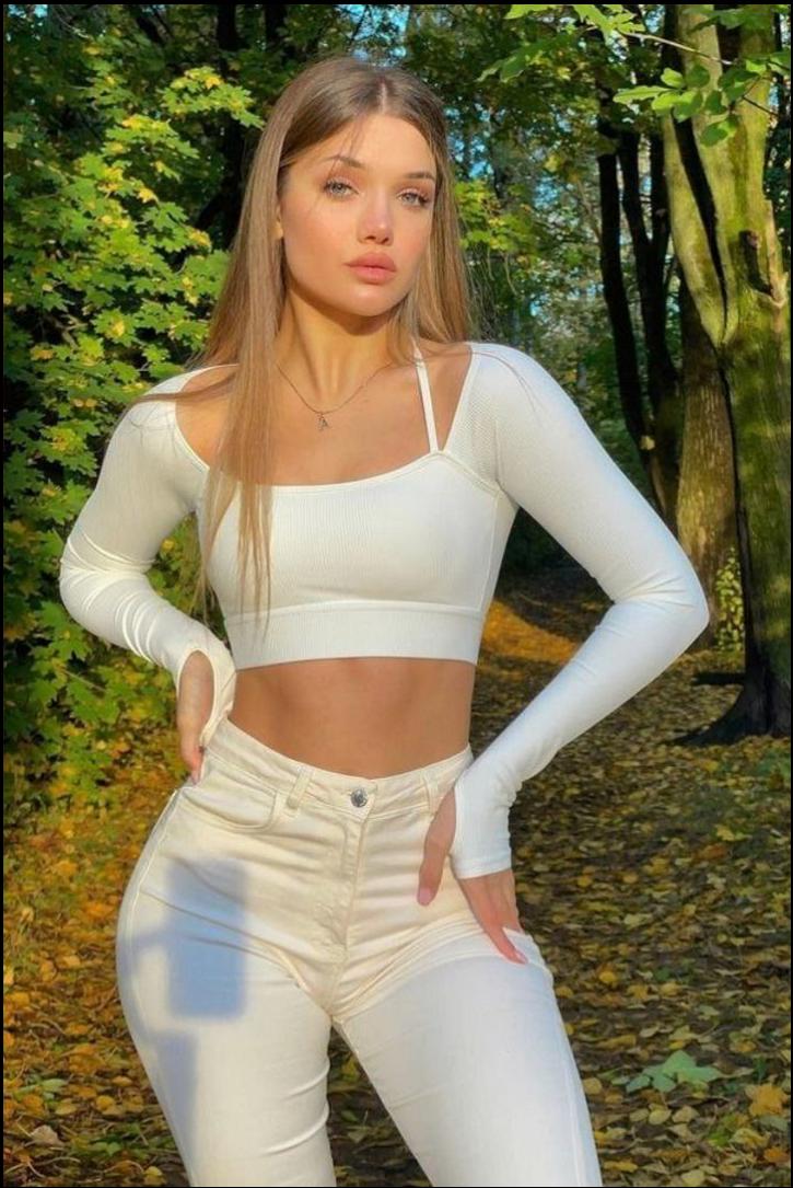 a woman in a black dress and a white tank top