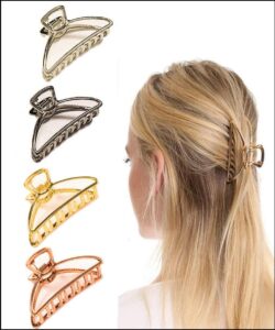 a woman is standing on a wall with a pair of scissors