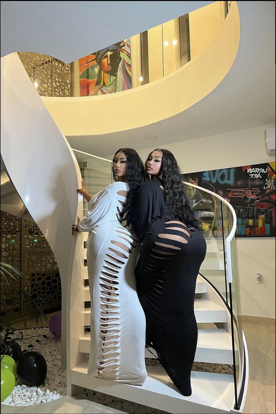 a woman is standing on a ledge with a surfboard