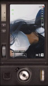 a tv showing a man in a black suit