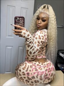 a woman in a dress holding a cell phone