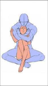 a woman in a blue dress holding a blue and white cat