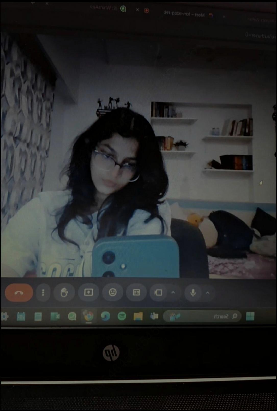 a woman is sitting on a tv screen