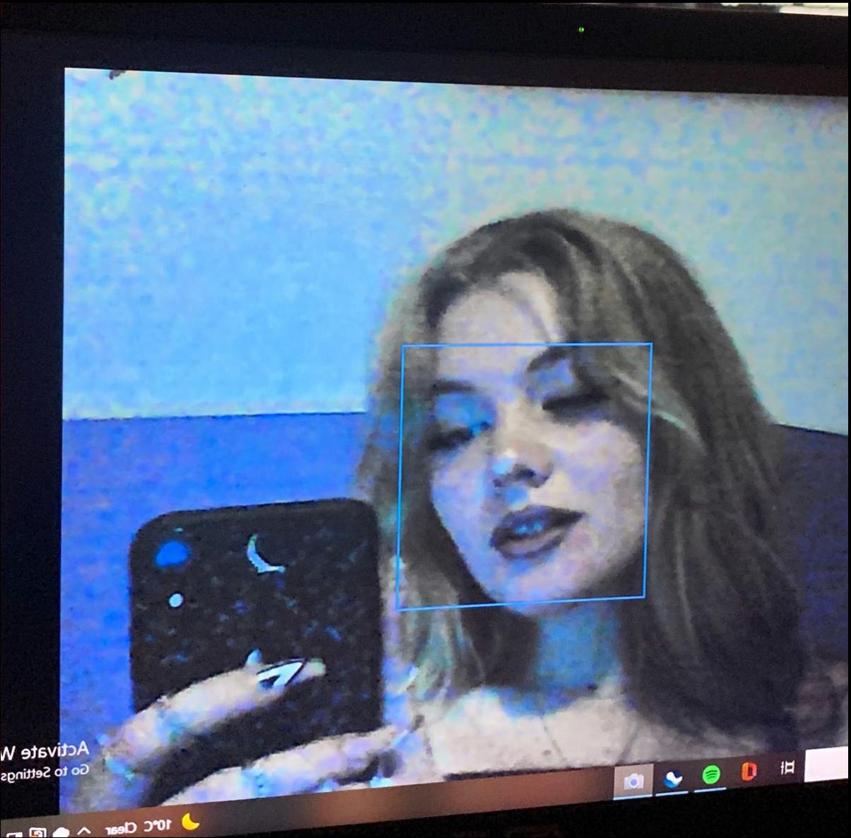 a woman is looking at a cell phone