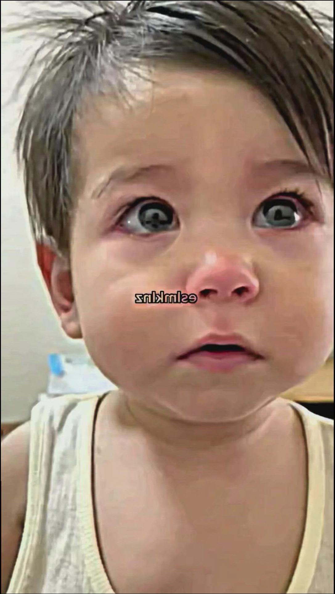 a small child with a smile on his face