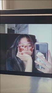 a woman taking a picture of herself in a mirror