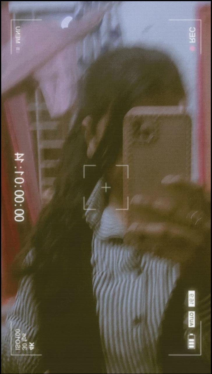 a woman is looking at her cell phone