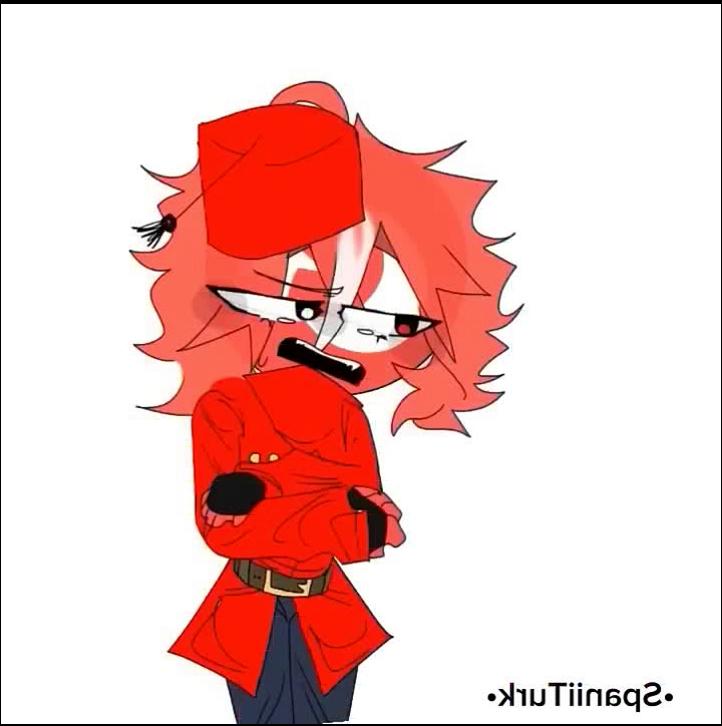 a red and white cat wearing a red hat