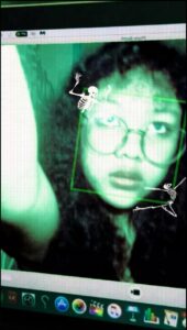 a person is looking at a laptop screen