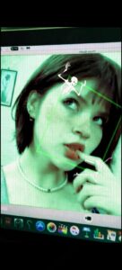 a woman is looking at a tv screen