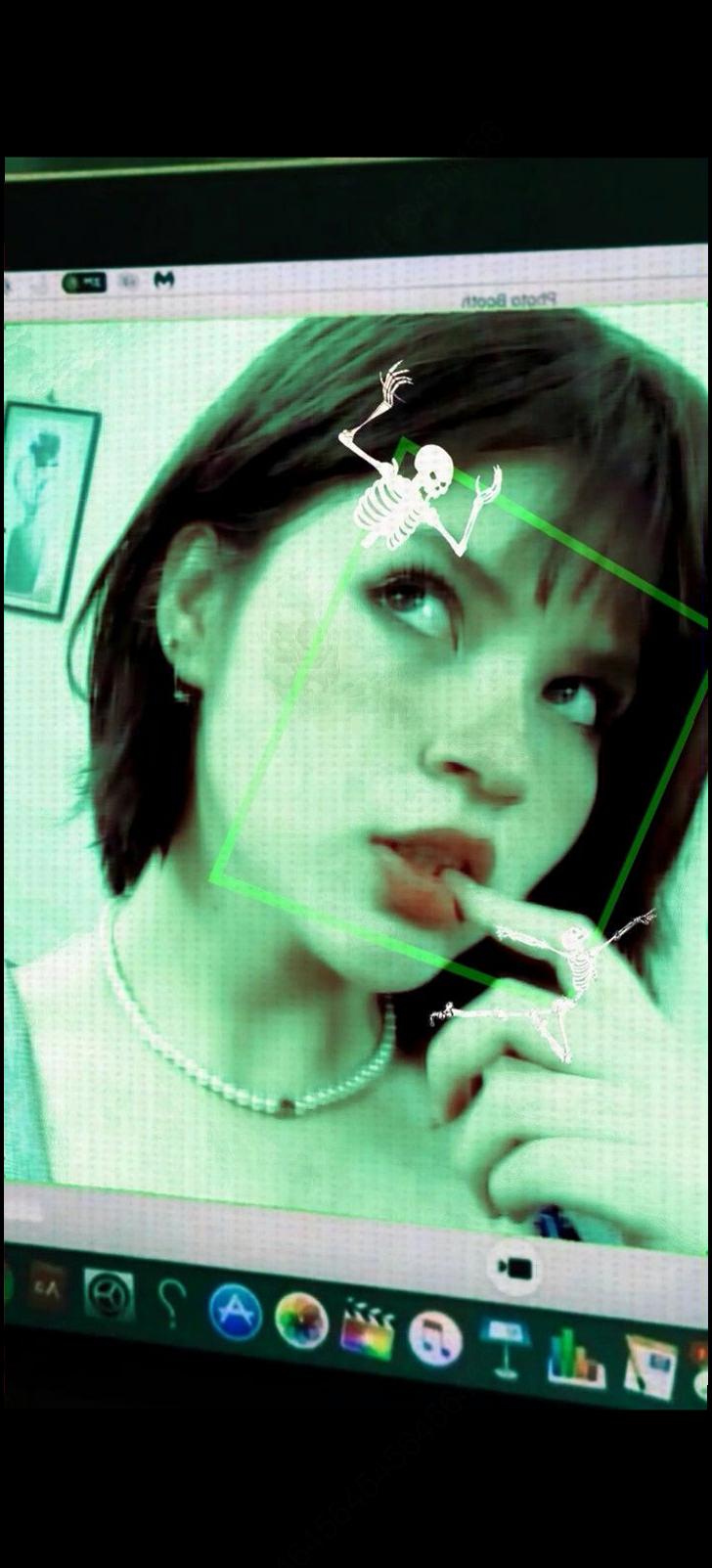 a woman is looking at a tv screen