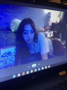 a woman is sitting in front of a tv