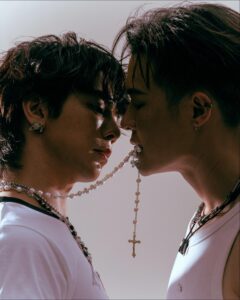 two people are standing in a field