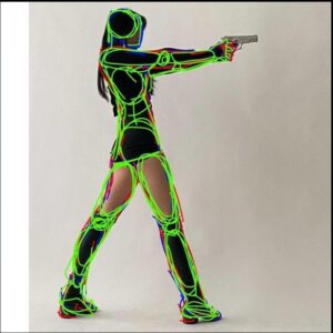 a woman in a black dress holding a knife