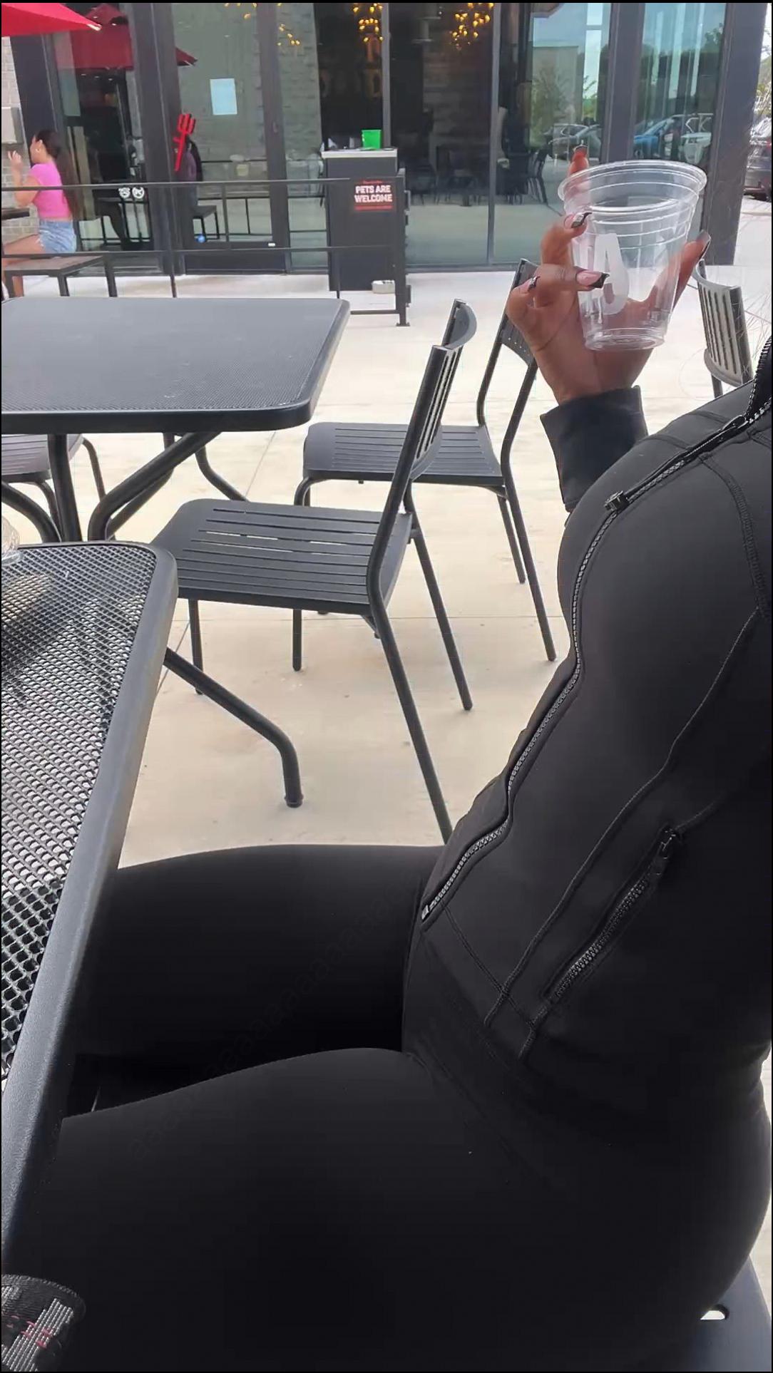 a woman is drinking a glass of water