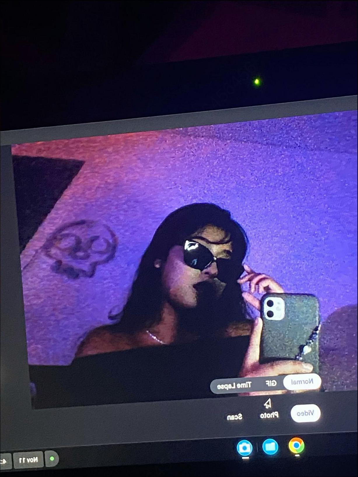 a person on a cell phone with a tv