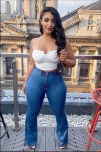 a woman is posing for a picture on a balcony