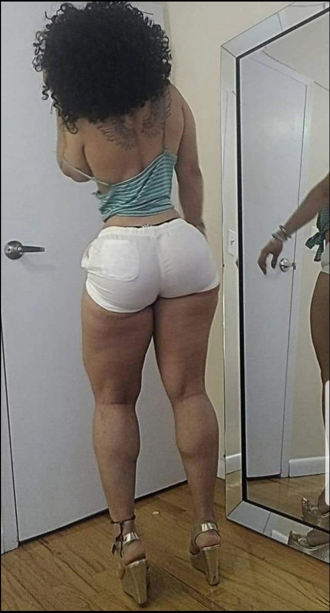 a young man is dressed in a white shirt and shorts