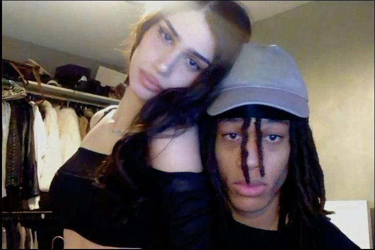 a man and a woman are posing for a picture