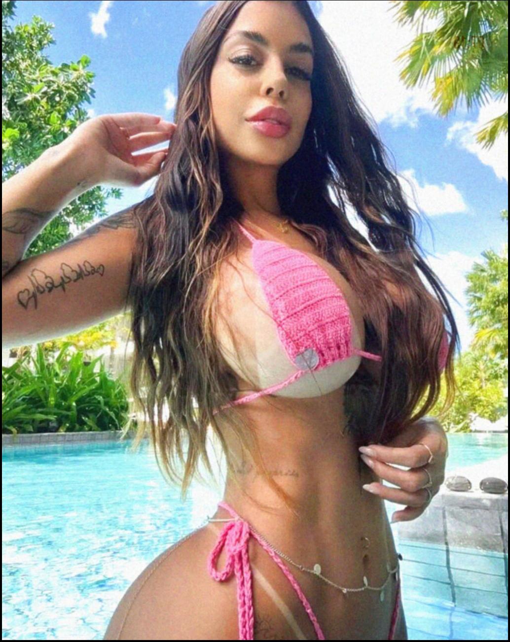 a woman in a bikini is standing in the water