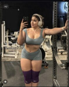 a woman in a bikini holding a camera