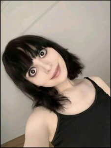 a woman with a black and white striped shirt