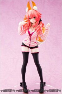 a woman in a pink dress and a pink skirt