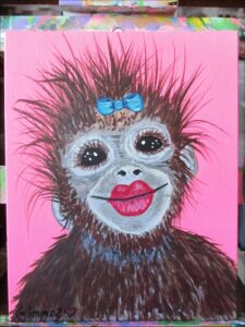 a painting of a stuffed animal with a picture of a cat on it