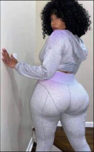 a woman in a white dress is standing on a white toilet