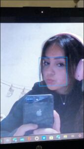 a woman is looking at a cell phone