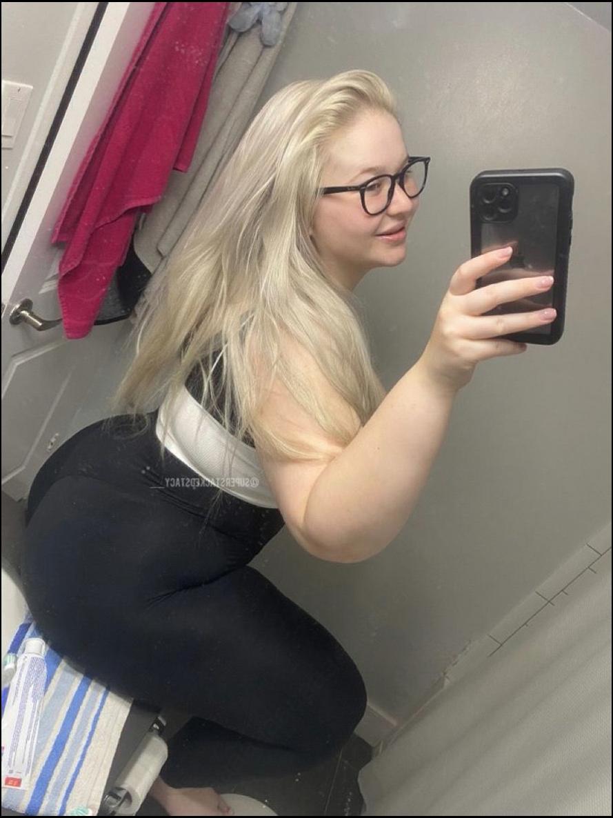 a woman is taking a picture of herself in a mirror