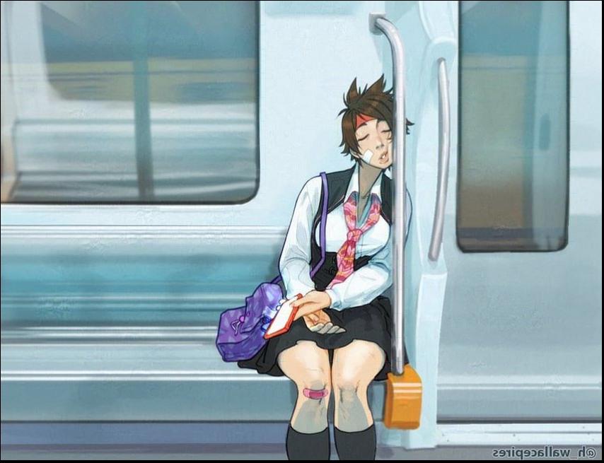 a woman is sitting on a train with a suitcase