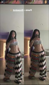 a woman in a bikini with a t-shirt and a tie