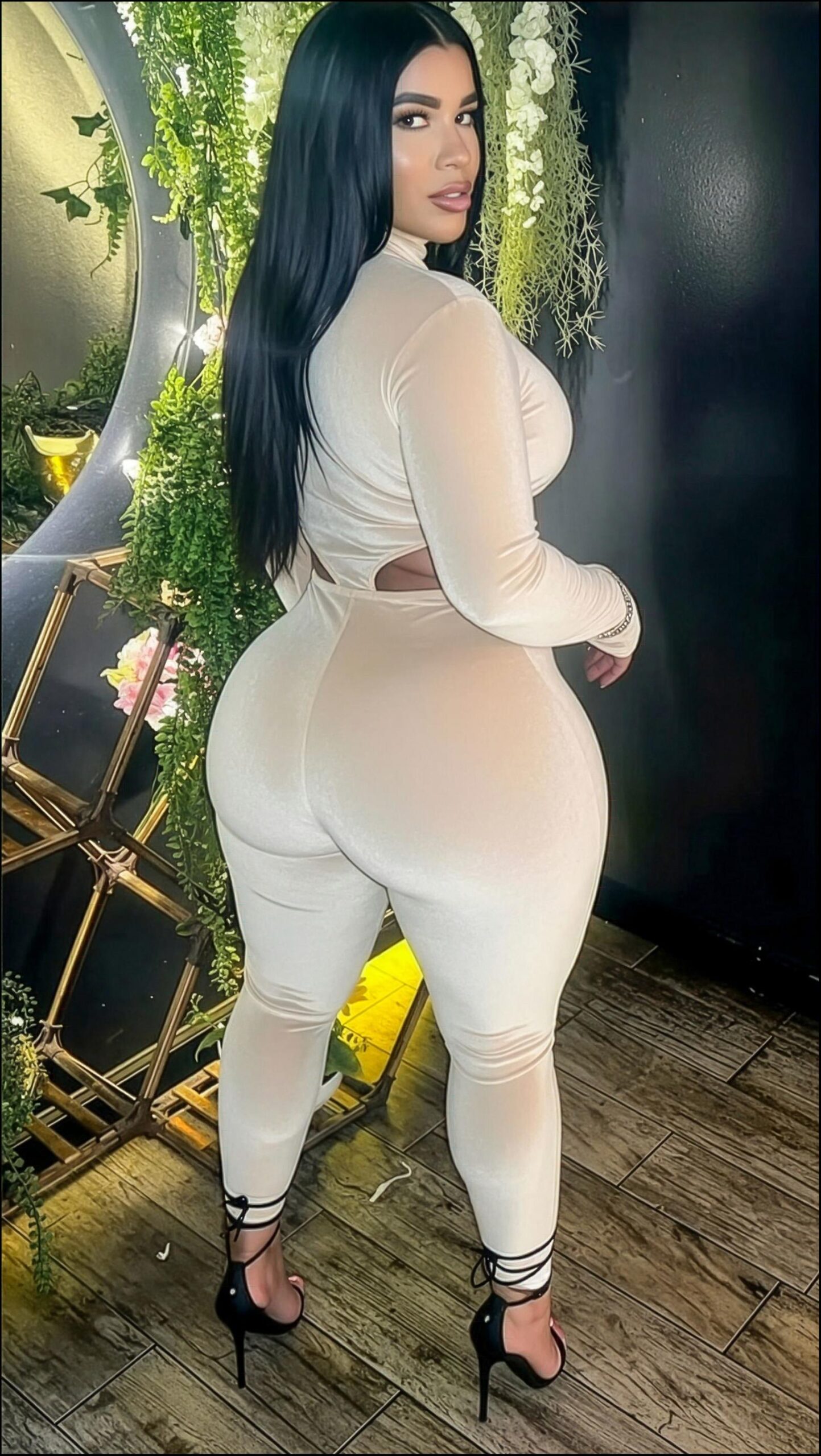 a woman in a white dress and black boots