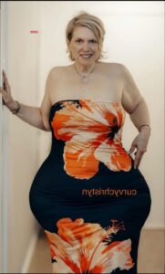 a woman in a bikini holding a black and white polka dot polka dot polka dot