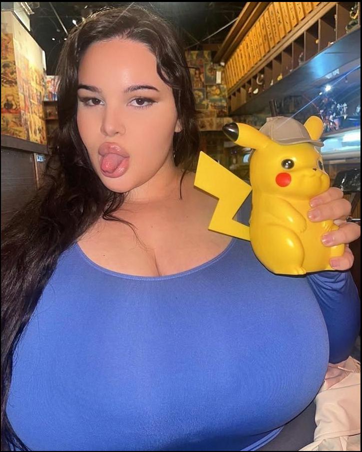 a woman in a pink shirt and a yellow and blue toy