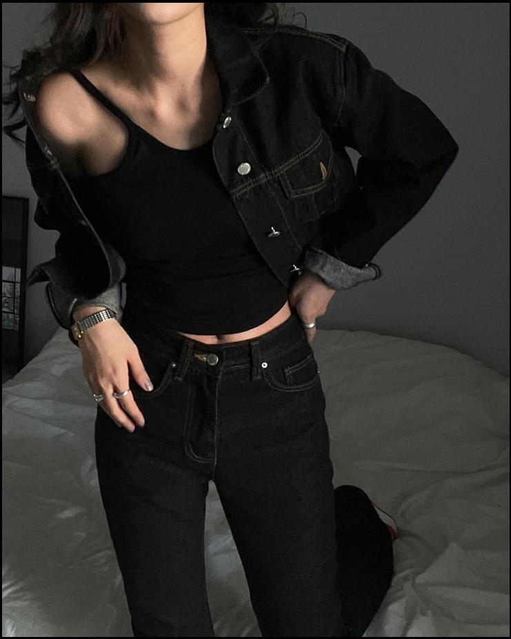 a woman in a black dress and a black hat