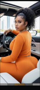 a woman in a black top is sitting on a motorcycle