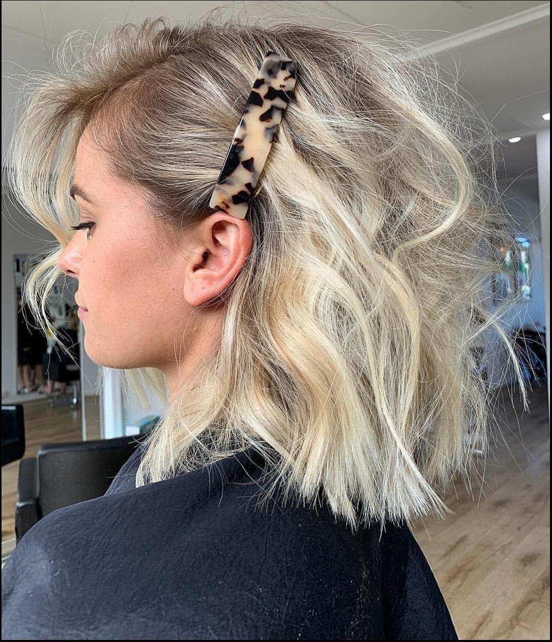 a woman in a black dress is wearing a black tie