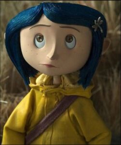 a stuffed bear with a red head on a brown head