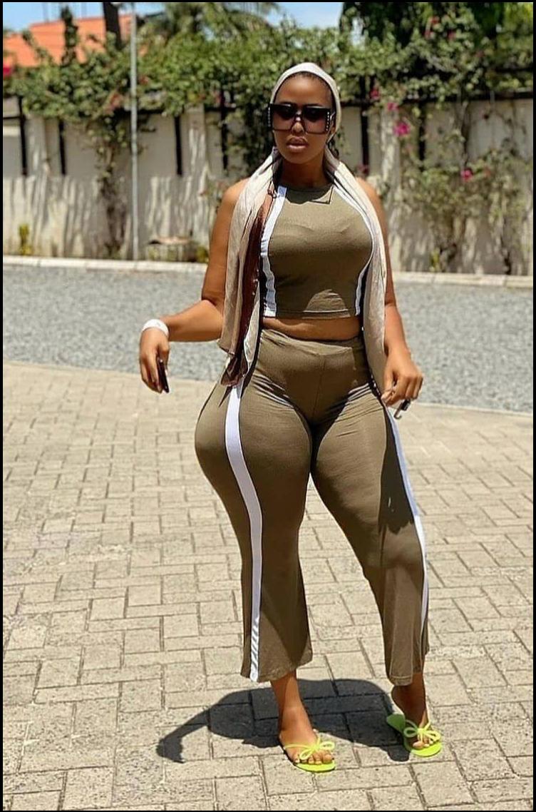 a woman in a black dress and a black skirt