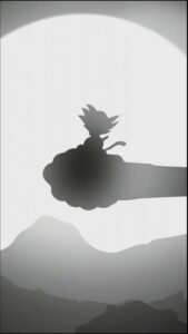 a bird is standing on a ledge in the middle of a mountain