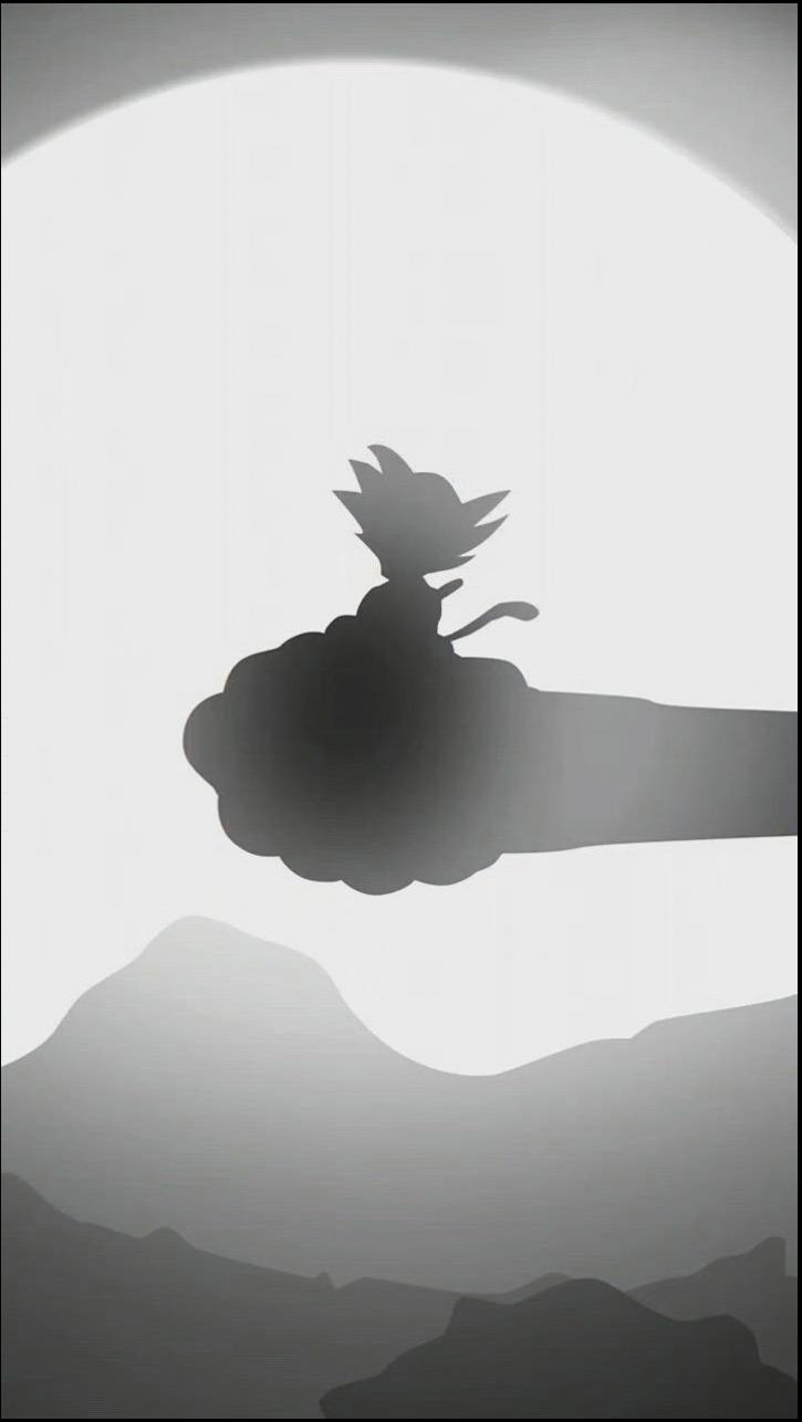 a bird is standing on a ledge in the middle of a mountain