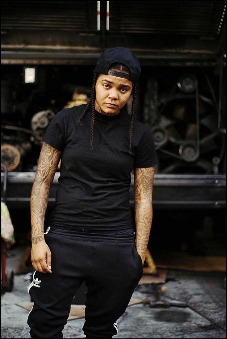 a woman wearing a black shirt and black pants