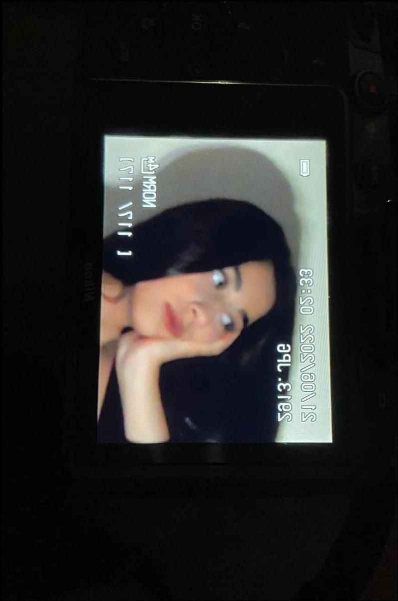 a woman is sitting in front of a tv