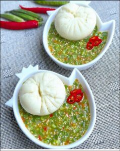 a bowl of food with a salad on top