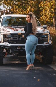 a woman is standing in the middle of a truck