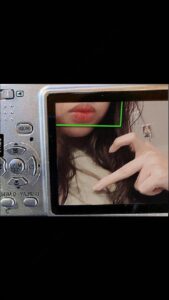 a woman is taking a picture of a woman in a mirror