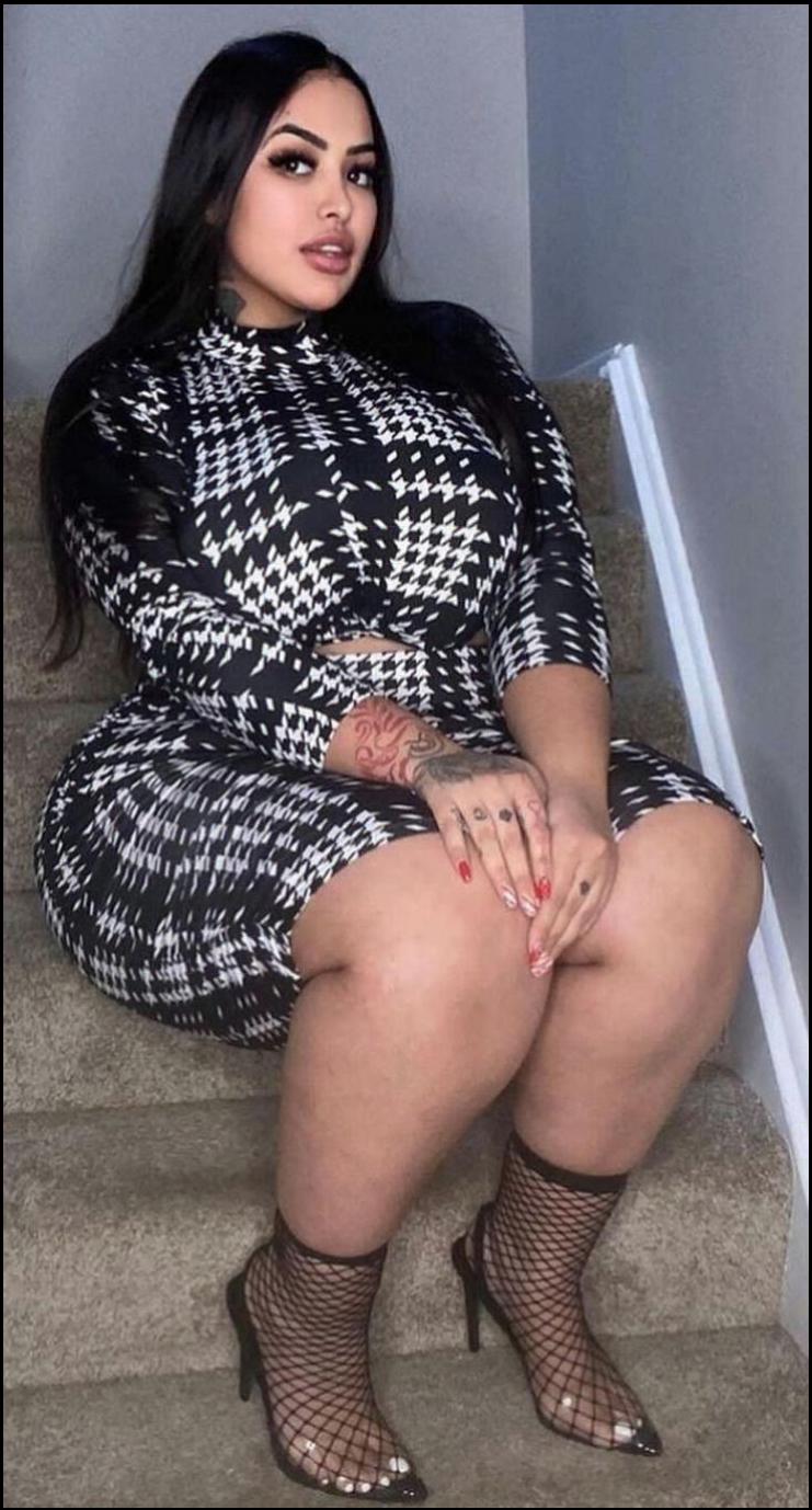 a woman is sitting on a couch with a bag