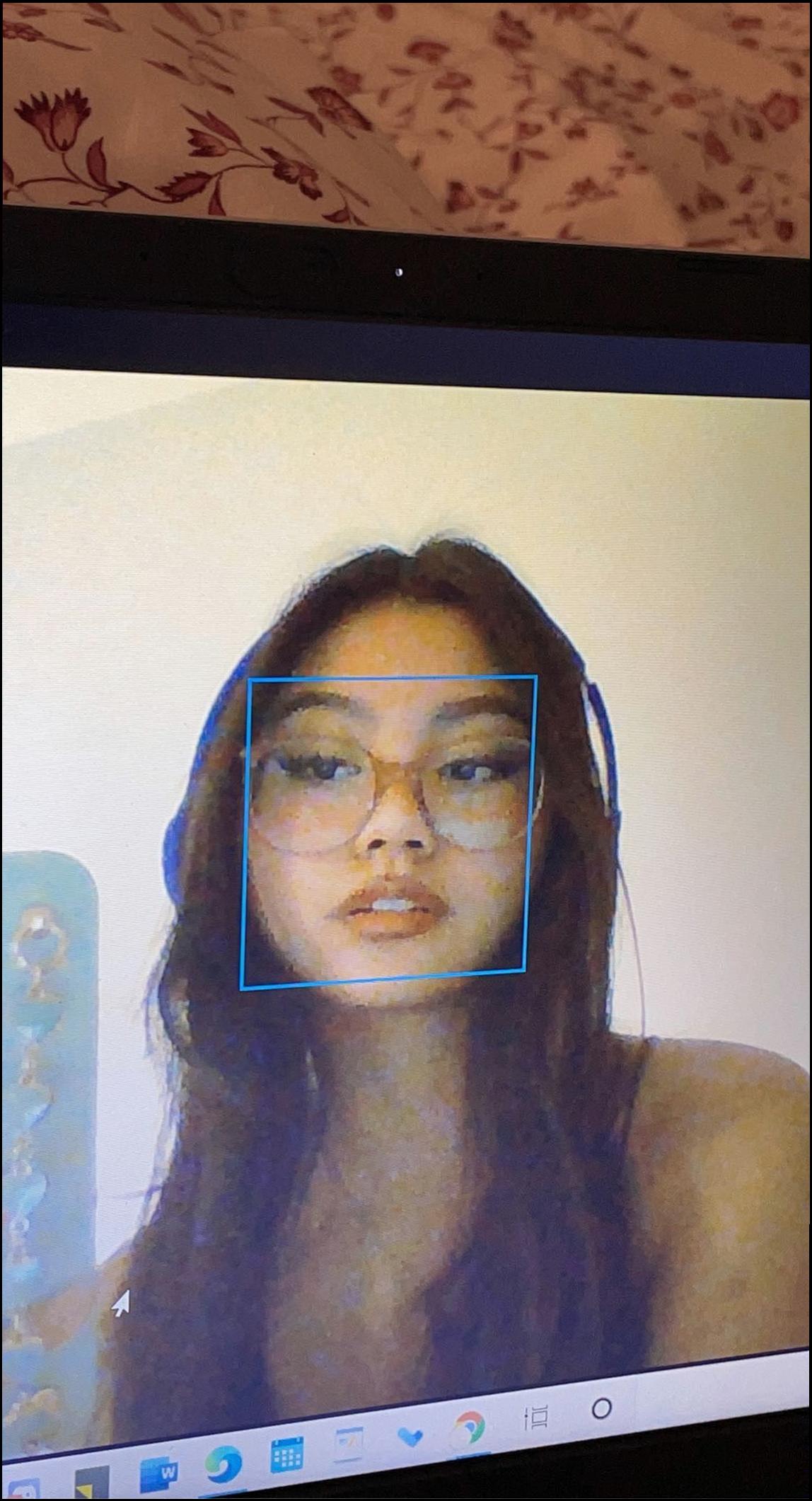 a woman is looking at a picture of a cat